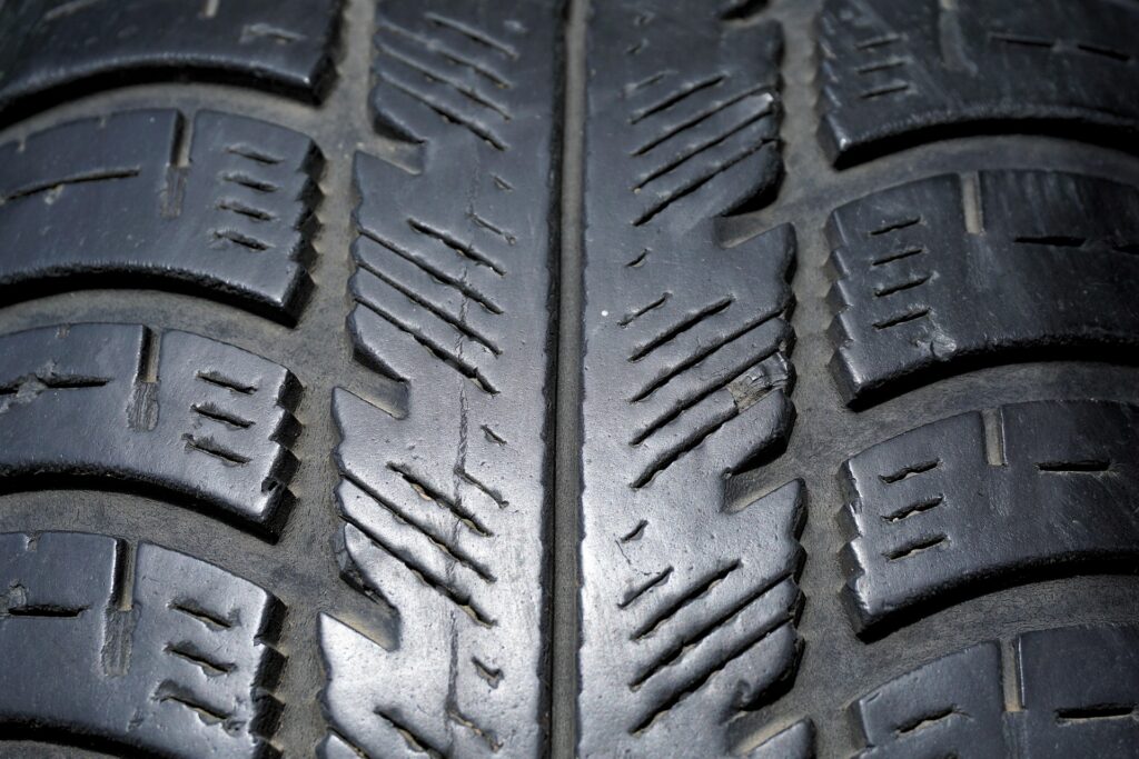 Close-up of a car tyre tread showing detailed grooves and patterns